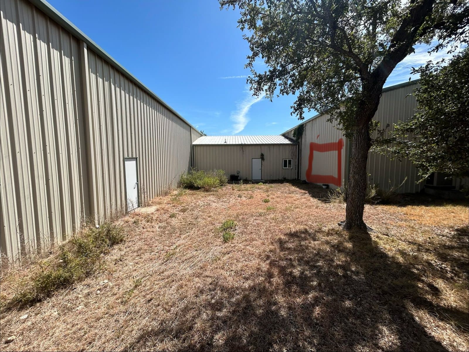 The empty outdoor space between the buildings, today