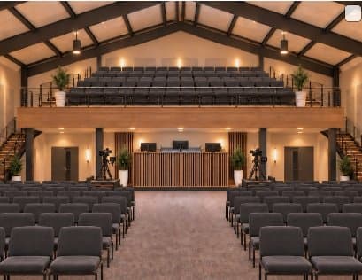 Concept rendering of the new sanctuary with mezzanine seating and a sound booth